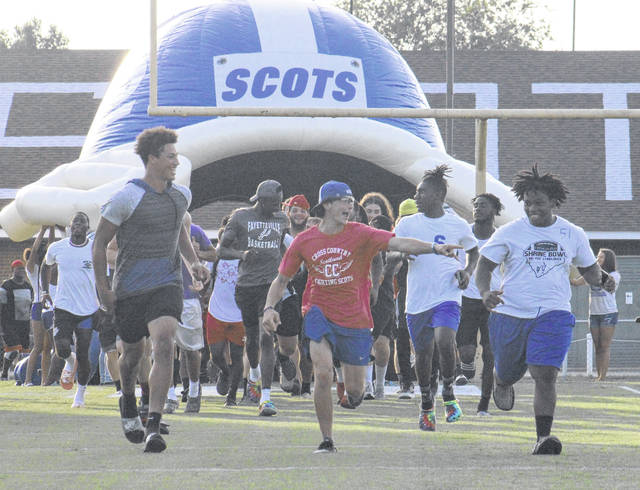 Players, cheerleaders get first look at new tunnel - Laurinburg Exchange