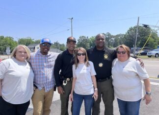 
			
				                                Carolina Hearts Home Care employees Carrie Pate, Angie Cline and Judy Locklear pose with Scotland County Sheriff’s deputies, Shonrell McKee, Ronald Locklear and Captain Roger Alford.
 
			
		