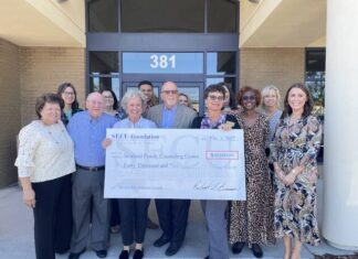 
			
				                                Members of the Scotland Family Counseling Center and State Employees Credit Union take a picture with a check of $40,000 that was granted by the SECU Foundation Wednesday morning.
                                 Photo| Brandon Hodge/ The Laurinburg Exchange

			
		